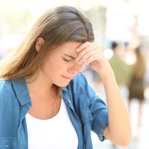 Painful,Girl,Suffering,Headache,Standing,In,The,Street